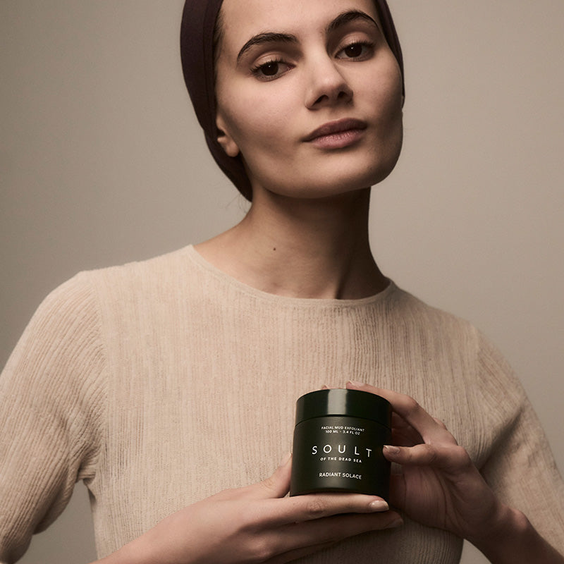 Woman holding OULT Radian Solace product 