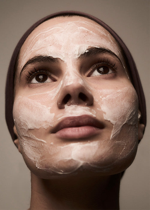 Woman applying Radiant Solice an her face